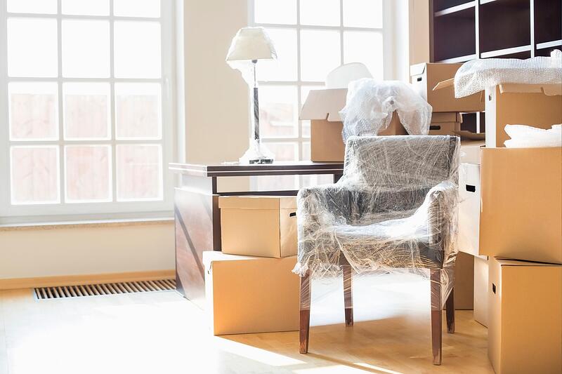 Moving boxes stacked in a garage