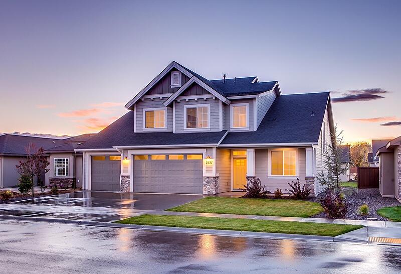 A two-story Florida home with a wide paver driveway