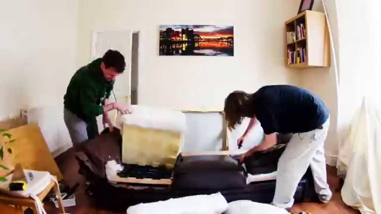 A couch being cut down with a saw