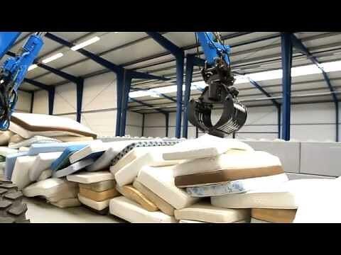 Mattresses moving through a recycling plant